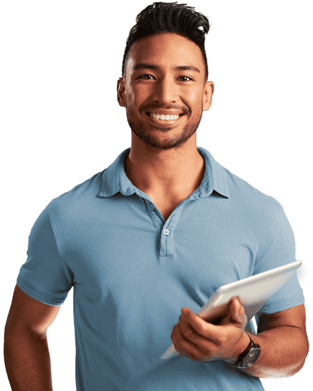 Man smiling and holding tablet