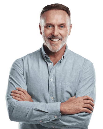 Man smiling with arms crossed